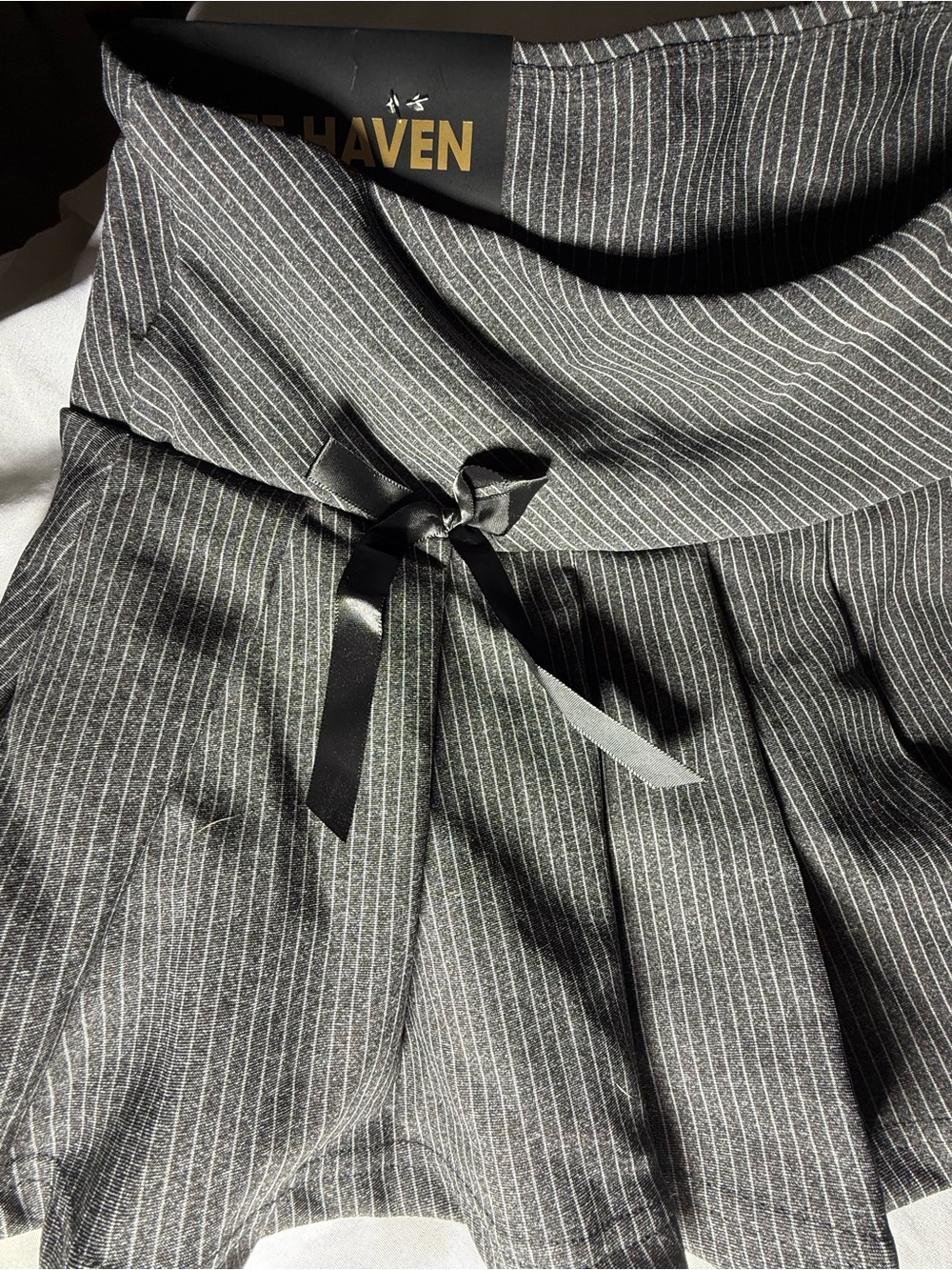 Free Haven Women's Pinstripe Pleated Mini Skort with black bow accents- Black- L - Picture 2 of 7
